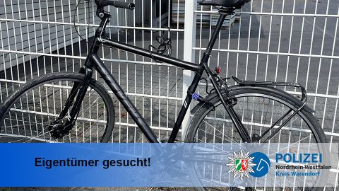 Fahrrad vor Zaun